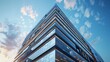 © improvee design - modern glass office building with a sleek design against a blue sky and clouds. The building is viewed from a low angle, giving it a towering presence.