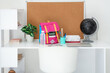 © Pixel-Shot - Stylish children's workplace with globe, laptop and school bag in room
