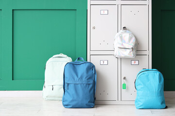 Poster - Locker with school backpacks near green wall