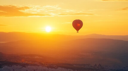 Poster - Hot Air Balloon Soaring at Sunrise Over Mountains