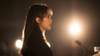 © Jirut - young Asian woman engaged in a heartfelt public speaking event