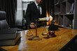 © aekachai - Male lawyer sitting and working, solving problems and work related to the legal work of lawyers.