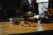 © aekachai - Male lawyer sitting and working, solving problems and work related to the legal work of lawyers.