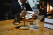 © aekachai - Male lawyer sitting and working, solving problems and work related to the legal work of lawyers.