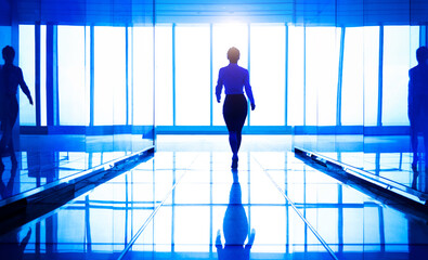 Canvas Print - Businesswoman walking in the office corridor