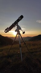 Wall Mural - Preparing for night sky observing with a astronomical telescope just before sunset.