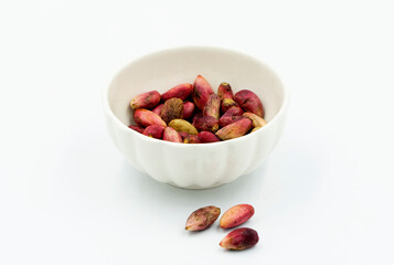 Fresh pistachios in shells to be eaten as a snack in a cup