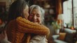 © liliyabatyrova - In a warm and inviting living room, a woman embraces her senior mother, expressing deep affection and connection, showcasing a beautiful moment of love and family togetherness