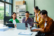 © Phushutter - In a boardroom, an Asian team discusses startup financials and business terms. They present strategies on acquisitions, cash flow, and investor relations, innovative approaches for company growth.