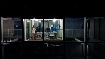 Poster - Group of Corporate Workers Analyzing Results From a Sales Campaign. Project Manager Presenting Data Chart on Screen, Employees Having a Conversation in a Meeting Room. View from Outside the Window