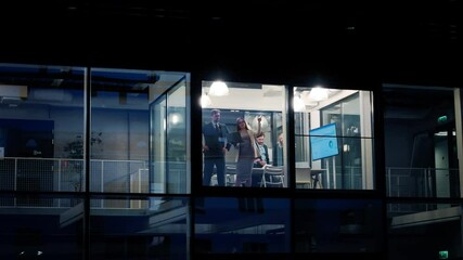 Aufkleber - Diverse Team Working in a Conference Room in the Evening. Managers Having Strategic Discussions During the Annual Report Presentation. Specialists Working in a Modern Glass Office, Using Computers 
