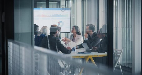 Poster - Diverse Team Working in a Conference Room. Managers Having Strategic Discussions During an Investing Presentation. Specialists Working in a Modern Glass Office, Using Computers and Paper Documents