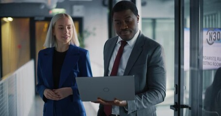 Poster - Elegant and Empowered Businesspeople Exit a Meeting in a Bright Office Building, Using Laptop Computer and Discussing Business Opportunities and Investment Deals. Smart Team Having a Conversation