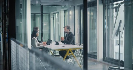 Poster - Team of Young Businesspeople Having Negotiations with a Company CEO in the Office in a Glass Room. Diverse Colleagues Sitting Behind a Meeting Table, Discussing Investment and Business Opportunities