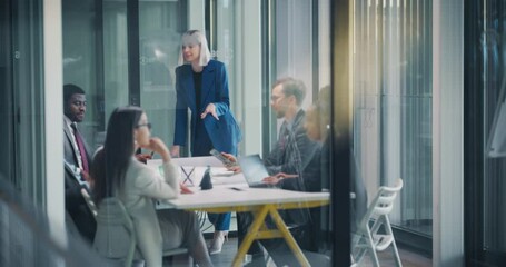 Poster - Group of Corporate Workers Analyzing Milestones of a Marketing Campaign. Young Beautiful Female Presenting Data and Results to Supervisors, Employees Having Conversations in a Glass Meeting Room