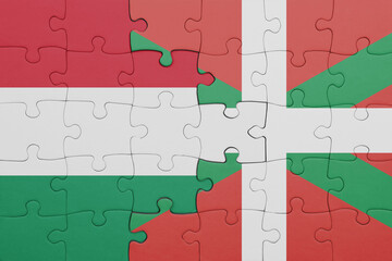 puzzle with the colourful national flag of basque country and flag of hungary.