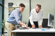© NINENII - Male colleague caucasian working and update tasks with milestones progress planning and professional investor working new start up project in the office.