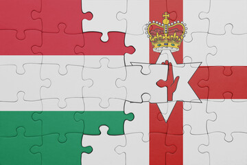 puzzle with the colourful national flag of northern ireland and flag of hungary.