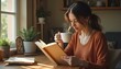 © Photo by mQ - A woman drinking tea or coffee while reading a book, enjoying a cozy and relaxing moment.