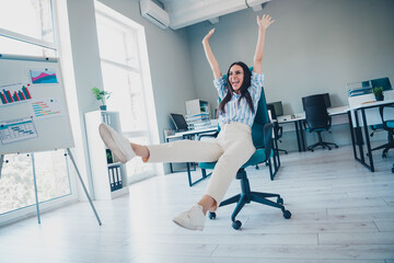 Poster - Full length photo of nice woman ride armchair have fun dressed striped formalwear comfortable light startup office room interior