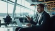 © Sasa Visual - Business travelers engage in work and communication while waiting in an airport lounge, creating a productive atmosphere