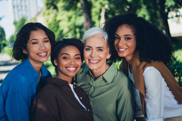 Sticker - Photo portrait of happy multi generational women cheerful smile together multiracial friends outdoor city park