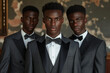 © apichat - Three young, confident African businessmen in formal attire posing with poise in a classic office environment.