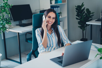 Wall Mural - Photo of smart chief female talk phone working wear striped formalwear comfortable modern office interior indoors workspace