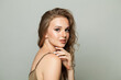 © artmim - Perfect female face. Woman with makeup, curly hairstyle and fresh skin on white background