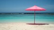 © pinporn manosri - A pink parasol on a sandy beach, symbolizing relaxation and leisure