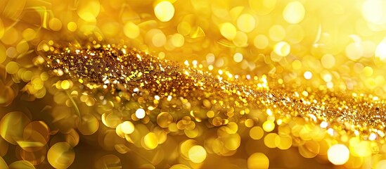 Poster - The holiday sparkle yellow gold bright textured background features a blurred section and copy space