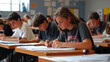 © Kanyanat - A classroom with students taking a test, focused expressions as they work through the questions.