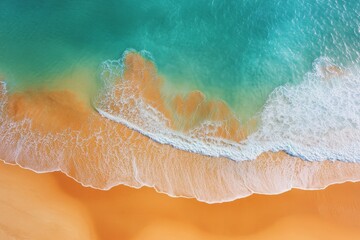 This photograph showcases a serene coastline where the turquoise waters gently meet the golden sands, creating a peaceful and idyllic beach scene bathed in sunlight.