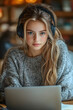 © Gonzalo - Distance education. Lady teenager in wireless headphones studying online on laptop computer at home, side view. Schoolgirl make homework assignment