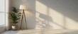 © Ilgun - Mockup of a blank wall featuring a lamp and a plant in an empty room. Copy space image. Place for adding text and design