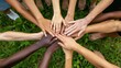 © EUT - Diverse hands together in unity. A photo depicting the concept of unity and teamwork, showcasing a variety of skin tones and hands joined in a circle.