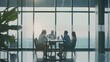 © VK Studio - Four colleagues are engrossed in a discussion around a table in a spacious, sunlit conference room, reflecting clarity and teamwork in a professional setting.