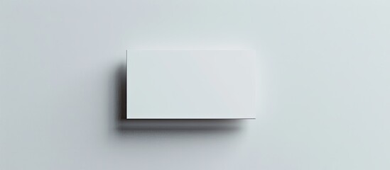 Business card against a white backdrop. Copy space image. Place for adding text and design