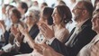 © VK Studio - A group of people sitting and clapping with joy and admiration during an event, capturing the essence of celebration and unity.