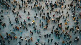 A diverse crowd forms a mosaic of colors and patterns, moving in unison across a large public square, reflecting the vibrancy of urban life.
