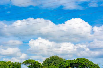 High voltage poles that transmit high voltage electricity. Year 2024 has a beautiful sky.