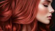 © Prostock-studio - A woman displays her striking red hair in a profile view, highlighting the smooth texture and rich color against a contrasting dark background.
