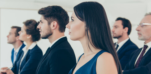 Wall Mural - Close up of group of young people on business seminar