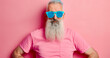 © Boris - Man with long beard and blue shades on pink backdrop