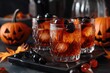© Olena - Halloween Whiskey. Old-Fashioned Whiskey Cocktail on Bar Counter with Pumpkin and Black Maraschino