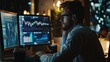© Zaleman - An investment bank analyst works at a computer with a multi-monitor workstation, analyzing real-time stocks, commodities, and exchange market charts.