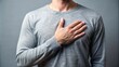 © lapeepon - A person standing with a hand on their heart, symbolizing honesty and trustworthiness, honesty, trust, integrity