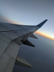 sunrise in the sky from plane