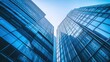 © NusratJahan - Blue glass skyscrapers, modern business center architecture background