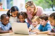 © hobonski - Teacher Guiding Students with Technology. A diverse group of young students gather around a laptop, engaged and learning, under the guidance of a smiling teacher.